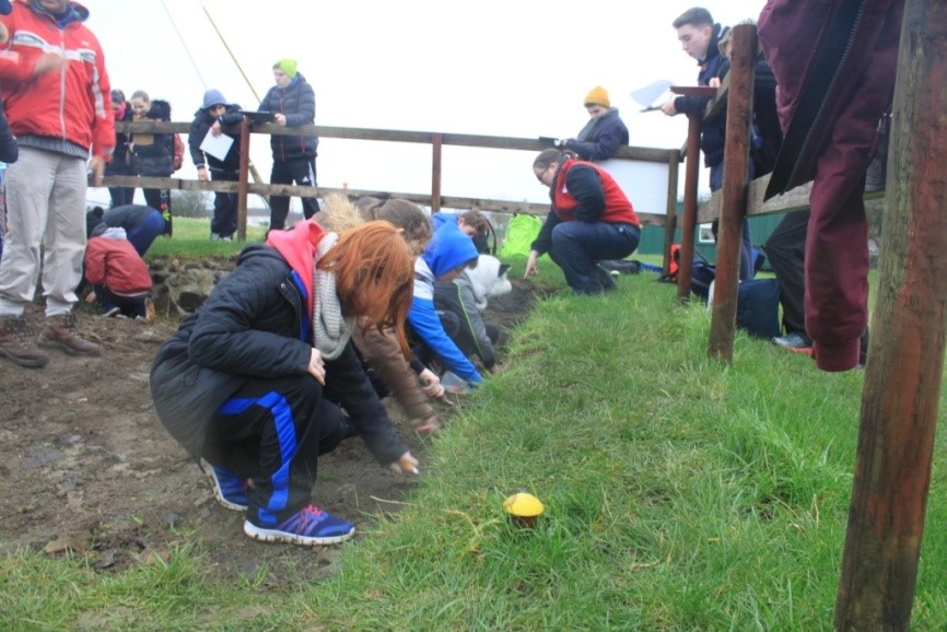 School children learning to dig