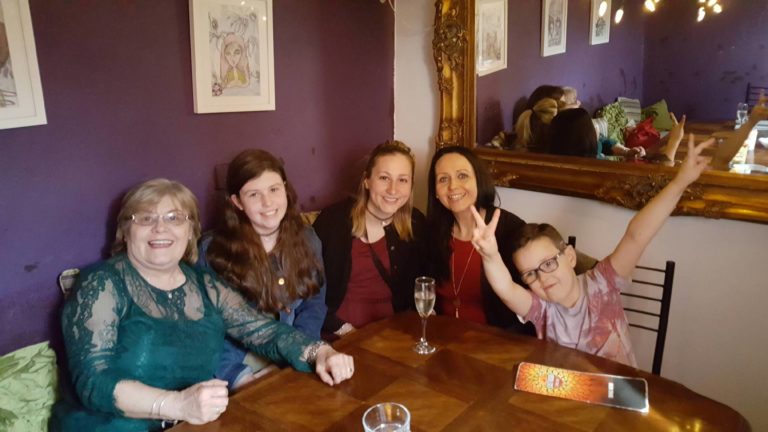 irish host family around a table with a student
