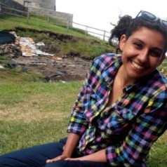 lauren-nofi, student poses for a picture in a field
