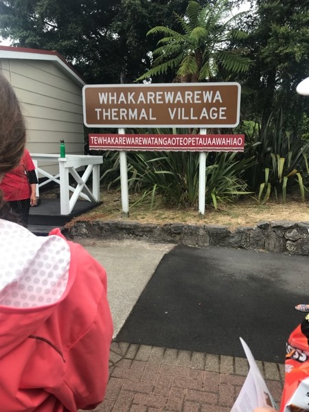 Picture of the sign welcoming visitors to Whakarewarewa Thermal Village