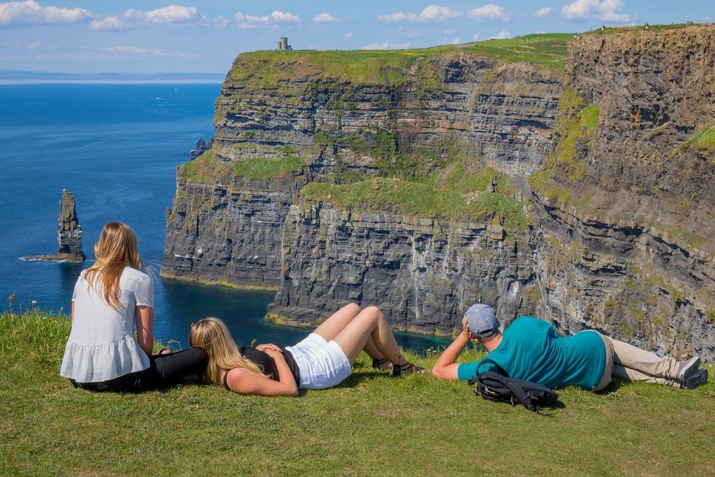 visitors looking at the Cliffs of Moher