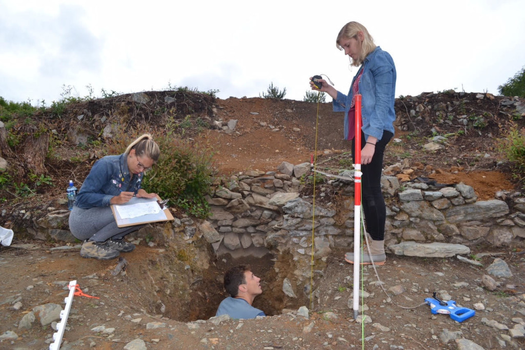 interns examine a site for their archeology internship