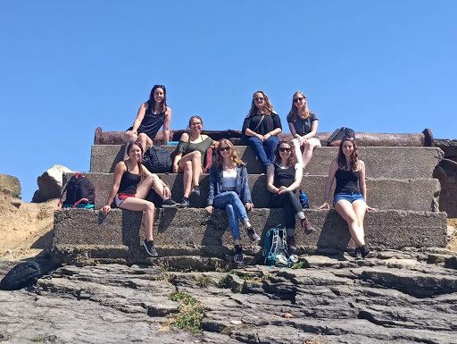 Group of students sitting at Hook Lighthouse