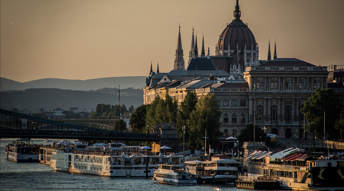 hungary at dusk with a boats on the river