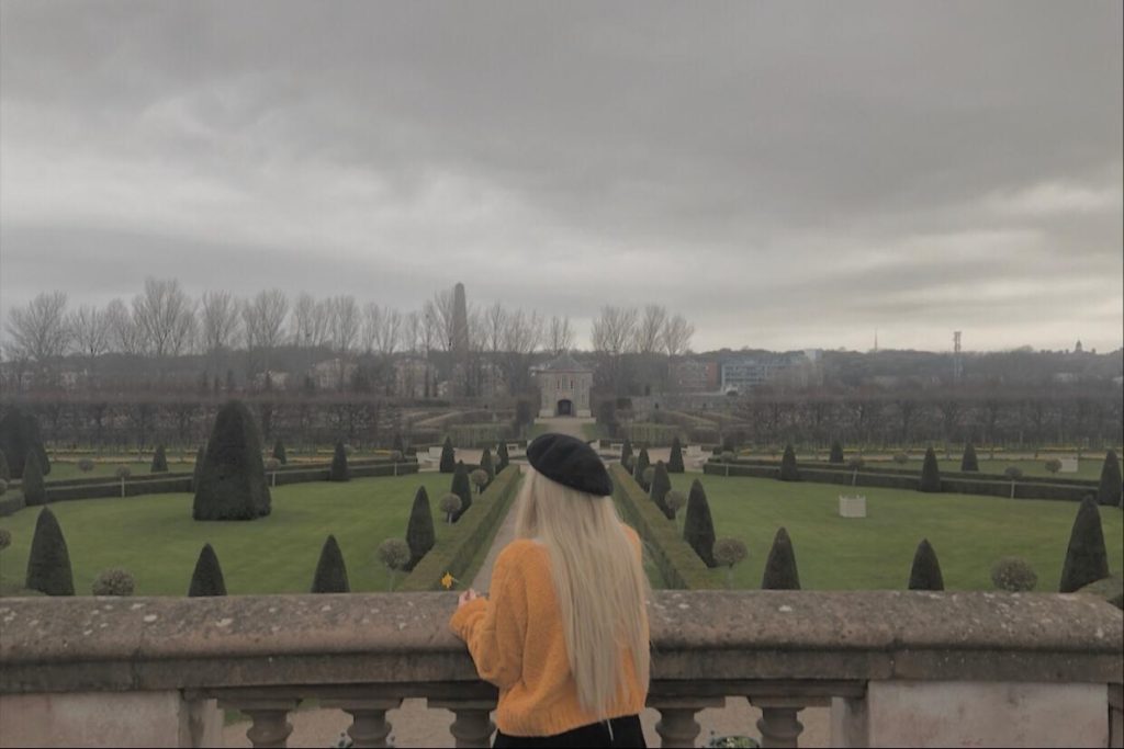 Dublin semester abroad student stands on a veranda and looks off to the distance