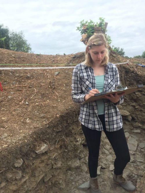 Archeology Intern at work in Ireland Student takes notes while doing a dig at their archeology internship in Ireland